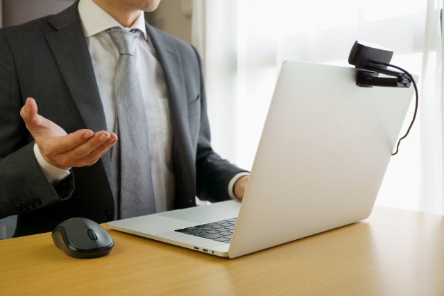 businessman-webcam-laptop-online-meeting